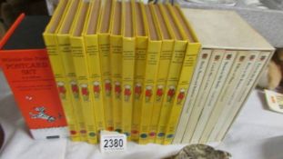 Twelve Rupert books, a set of six Gerald Durrell books and a Winnie the Pooh postcard set.