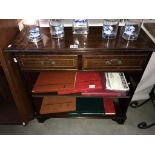 A mahogany effect small wall unit with 2 drawers