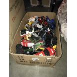 A box of play worn diecast cars
