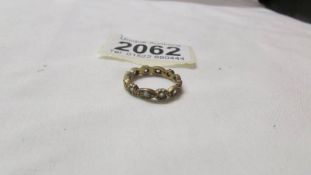 A 9ct gold eternity ring, size K. 2.2 grams.