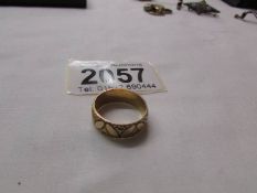 An 18ct gold engraved wedding ring, size L half, 4.2 grams.