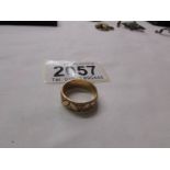 An 18ct gold engraved wedding ring, size L half, 4.2 grams.