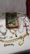 A mixed lot of necklaces, some with matching bracelets.