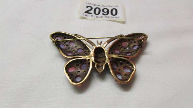 A stone set butterfly brooch in yellow metal. - Image 2 of 2