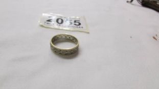 A 9ct gold eternity ring, size J half.