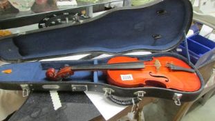 A cased Skylark violin.