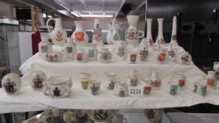 Thirty five pieces of W H Goss crested china.