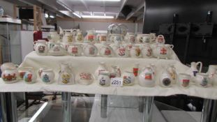 Sixty pieces of W H Goss crested china.