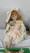 A limited edition porcelain doll by Adele's Puppenhaus 'Fiona', 174/1000 and a porcelain baby doll.