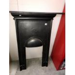 A cast iron bedroom fireplace,