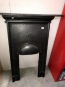 A cast iron bedroom fireplace,