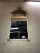 A vintage painted wrought iron frame mirror,