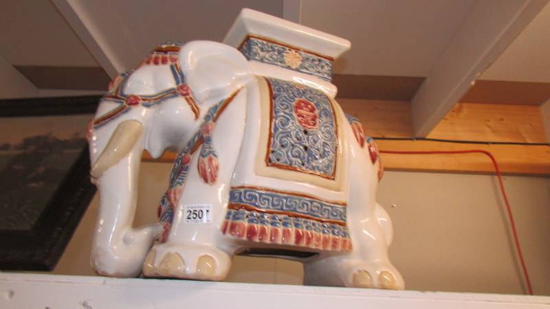 A large pottery elephant garden stool.