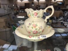 A pink floral basin and jug