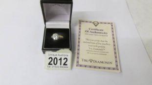 A 9ct gold ring set large simulated "Tru Diamond" with certificate, size T.