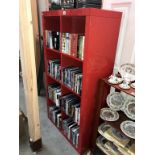 A red pigeon hole type bookcase shelf unit (79cm x 39cm x 150cm) (Collect only)