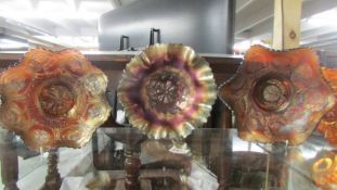 Three carnival glass bowls - Cosmos variant, Amethyst Dragon & Lotus and one other.