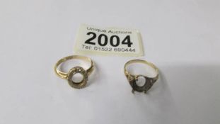 Two 9ct gold rings both missing stones, 3.9 grams.