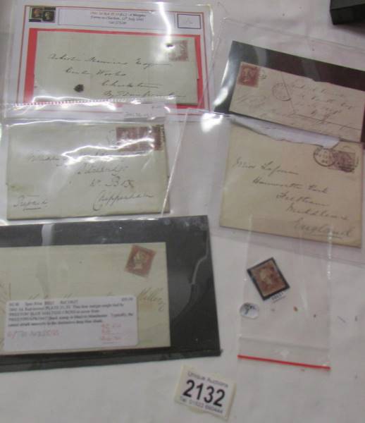 A quantity of Victorian penny red stamps, some on envelopes.