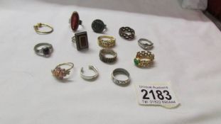 A mixed lot of white and yellow metal dress rings.