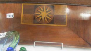 A mahogany inlaid tray.