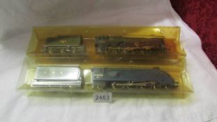 A Hornby 'OO' gauge Mallard and Evening star engines with tenders.