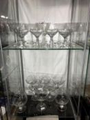 2 shelves of vintage drinking glasses