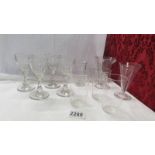 Three glass measures, 4 liquor glasses and 3 small fine glass tumblers.