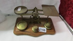 A set of brass postal scales.