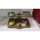 A set of brass postal scales.