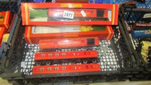 Four Hornby Royal Mail carriages and an empty box.