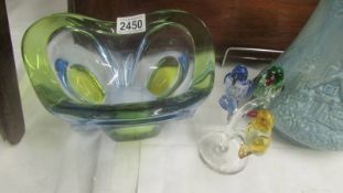 A Studio glass bowl and three glass birds on a tree.