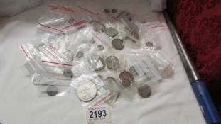 A collection of coins including silver, Victoria, Churchill crowns etc.