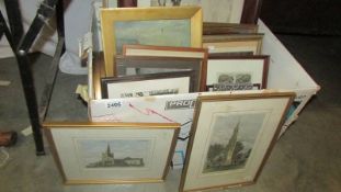 A large box of assorted paintings and prints.