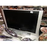 A 27" LG tv with remote control