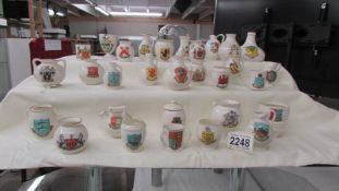 Thirty pieces of W H Goss crested china.