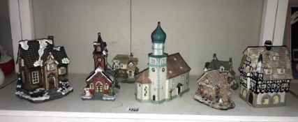 A selection of pottery and resin continental buildings,