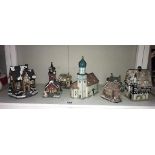 A selection of pottery and resin continental buildings,