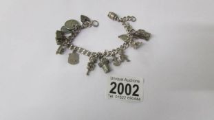 A silver charm bracelet, 45 grams.