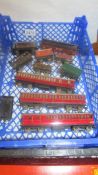 A selection of early tin plate Hornby/Triang OO/HO gauge carriages and wagons.