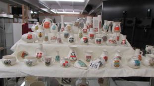 Forty five pieces of W H Goss crested china.