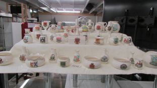 Forty pieces of W H Goss crested china.
