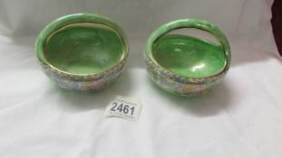A pair of fine Maling lustre bowls with handles.