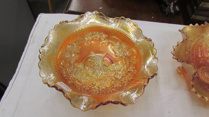 Four carnival glass marigold bowls - Imperial windmill, Fenton chrysanthemum, - Image 3 of 5