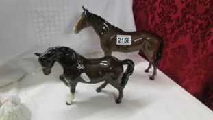 Two Beswick horses.