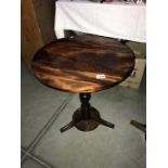 A round mahogany side table