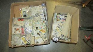 A large quantity of cigarette cards in two boxes.