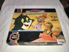 A vintage Chad Valley Tom and Jerry sliderama projector