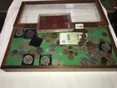 A jewellers display cabinet of coins including crowns etc