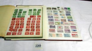Two albums of UK and world stamps.